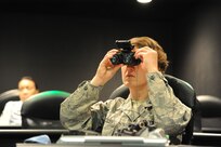 Capt. Mari Metzler, 31st Aerospace Medicine Squadron, Aviano Air Force Base, Italy, practice aligning night vision goggles during a Night vision goggles class held Oct. 28, 2013 at Joint Base San Antonio-Randolph, Texas.  (U.S. Air Force photo by SrA Lincoln Korver)
