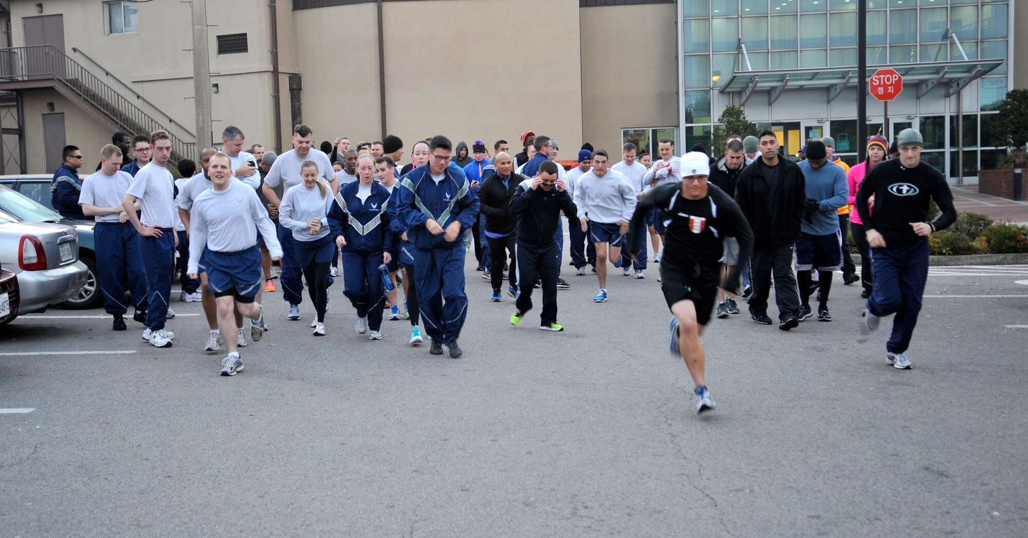 Participants in the Combined Federal Campaign 5K begin the race at Osan Air Base, Republic of Korea, Nov. 1, 2013. The CFC hosted the run to mark the end of the campaign season, which has been extended by three weeks to Dec. 7. (U.S. Air Force photo/Staff Sgt. Emerson Nuñez)