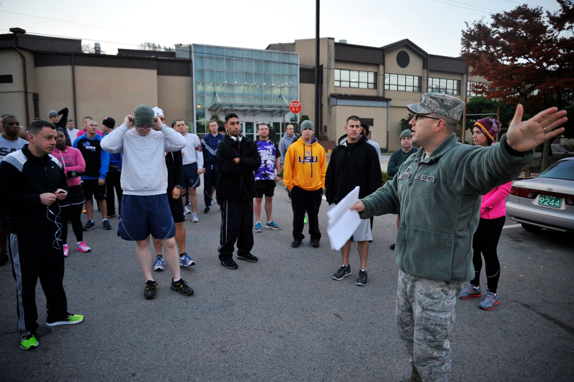 Capt. Larry Sepassi, 36th Aircraft Maintenance Unit assistant officer in charge, gives a safety briefing to runners before the start of the Combined Federal Campaign 5K at Osan Air Base, Republic of Korea, Nov. 1, 2013. The CFC allows federal employees to donate to more than 2,500 eligible non-profit organizations who provide health and human service benefits throughout the world. (U.S. Air Force photo/Staff Sgt. Emerson Nuñez)