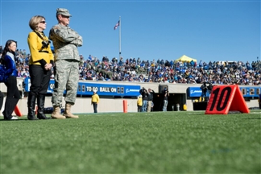 Chairman of the Joint Chiefs of Staff Gen. Martin E. Dempsey and his wife Deanie watch the Army versus Air Force football game from the sidelines at Falcon Stadium in Colorado Springs, Colo., on Nov. 02, 2013.  The Air Force Falcons beat the Army Black Knights with a score of 42-28.  