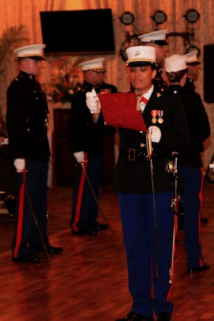 The ceremony adjutant, 1st Lt. Roxanne E. Kilmer, narrates for the 3rd Marine Logistics Group’s Marine Corps birthday ball Nov. 1 at the Butler Officers Club on Camp Foster, Okinawa, Japan. The event celebrated the Marine Corps’ 238th birthday, which is on Nov. 10. The celebration differs from last year in that the officers and staff noncommissioned officers participated in a combined ball this year, according to one officer in attendance. Kilmer is with 3rd MLG, III Marine Expeditionary Force.
