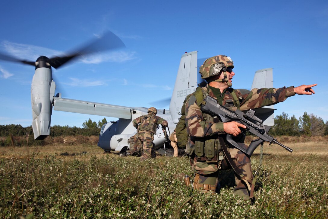 Legionnaires from the 2nd Foreign Infantry Regiment of France's 6th Light Armored Brigade set up landing zone security for an MV-22B Osprey with Special-Purpose Marine Air-Ground Task Force Crisis Response Oct. 30, 2013, at Camp des Garrigues, France. The event was part of a week-long bilateral training exercise between U.S. Marines with SP-MAGTF Crisis Response and French Legionnaires. The Osprey was the first of its kind to land on French soil as part of a military exercise. SP-MAGTF Crisis Response is a self-mobile, self-sustaining force capable of responding to a range of crises to protect both U.S. and partner-nation security interests in the region, as well as strengthening partnerships throughout the U.S. European Command and U.S. Africa Command area of responsibility. (U.S. Marine Corps photo by Cpl. Michael Petersheim)