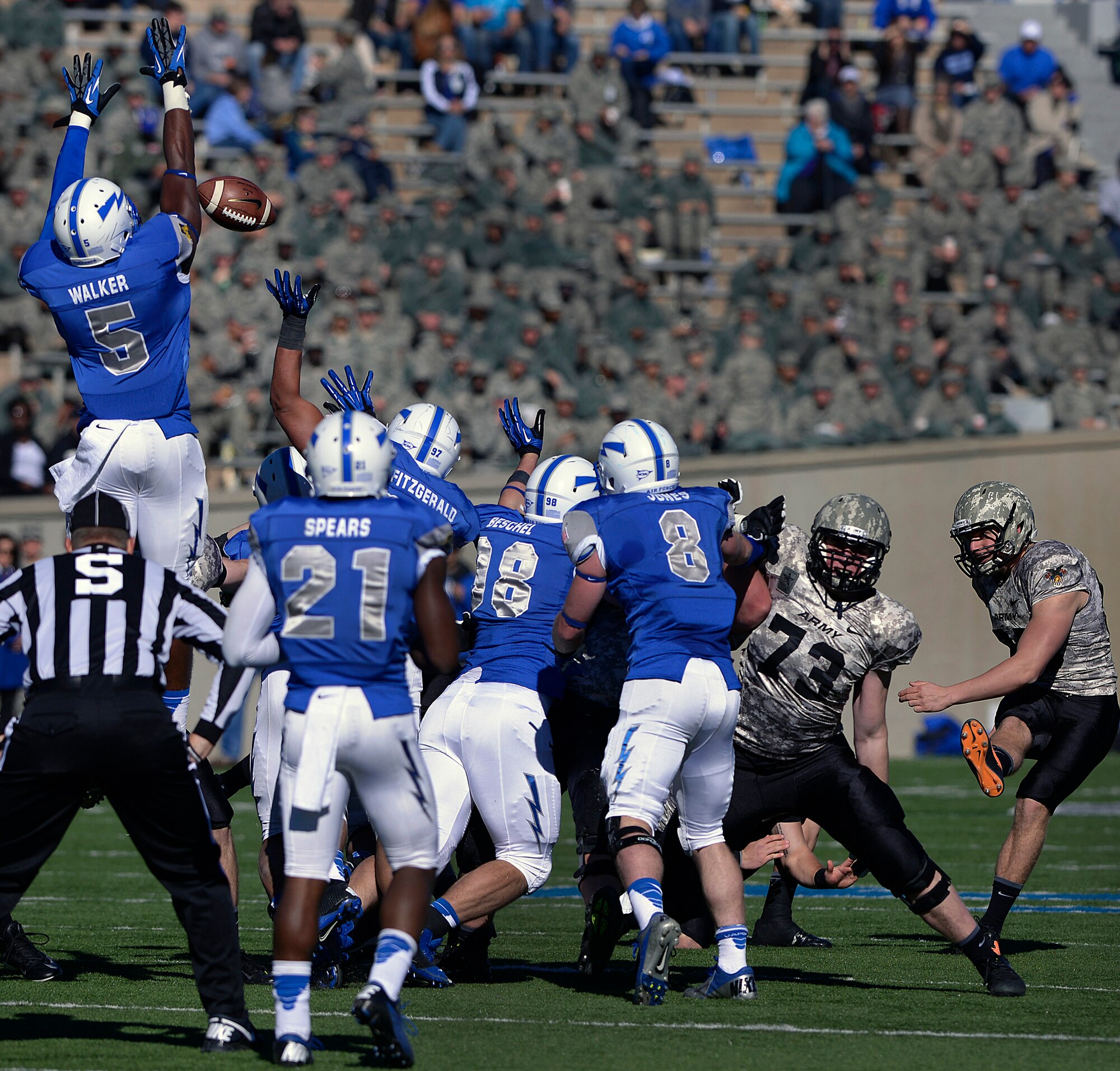 Air Force sophomore defensive back Dexter Walker goes vertical to block an Army field goal attempt during the Air Force-Army game Nov. 2, 2013, at Falcon Stadium, Colorado Springs, Colo. Defensive lineman Nick Fitzgerald got a hand on the kick to block it. 