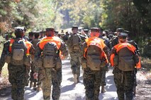Marines with Marine Aviation Logistics Squadron 29 press on as they participate in a six-mile motivational hike, Nov. 4. The Marines reached their hiking destination and boarded CH-53E Super Stallions for transport to their origin point.