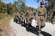 Marines with Marine Aviation Logistics Squadron 29 participate in a six-mile motivational hike, Nov. 4. The Marines reached their hiking destination and boarded CH-53E Super Stallions for transport to their origin point.
