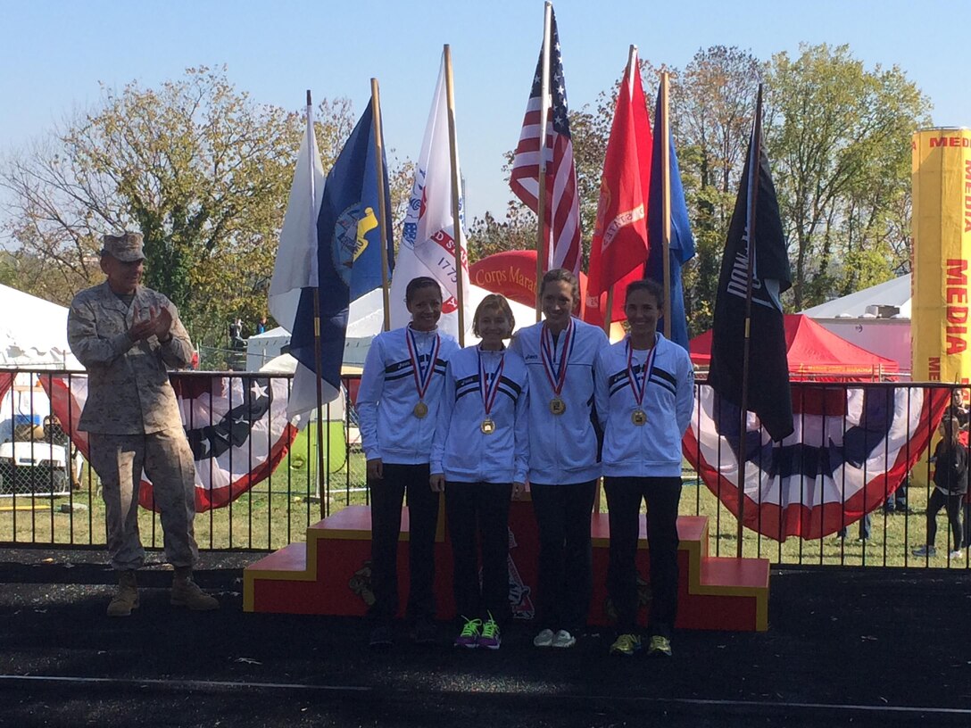 Army women win team gold medal at the 2013 Armed Forces Marathon Championship.  From left to right:  CPT Varnika Ensminger, CW4 Deanna Merriman, CPT Kelly Calway, MAJ Emily Potter.