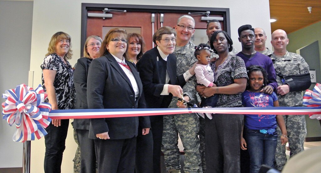 Patricia Fatherree, front left, stands next to Ann Horrell, who cuts the ribbon on the Madigan-South Sound Community Medical Center.  The $740,000 clinic, located in Olympia, Wash., will be able to serve up to 8,200 patients. 