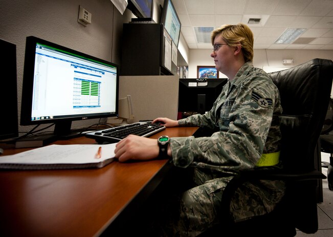 Senior Airman Melanie Buelo, 99th Logistics Readiness Squadron support agreement manager, checks the simulated deployed schedule of events Nov. 5, 2013, at Nellis Air Force Base, Nev. The exercise began with a recall of forces to initiate a simulated short-notice deployment. (U. S. Air Force photo by Airman 1st Class Jason Couillard)