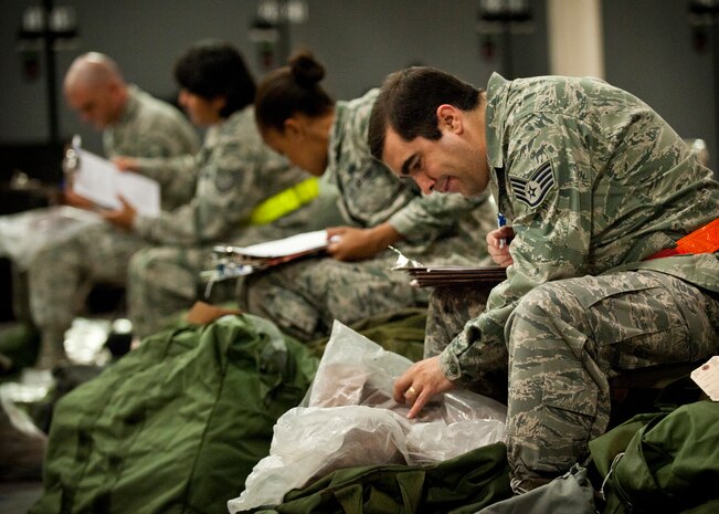 Staff Sgt. David Strate, 99th Force Support Squadron manpower analyst, participates in an operational readiness exercise, Nov. 5, 2013, at Nellis Air Force Base, Nev. The exercise evaluated the wing's ability to execute a short-notice mass deployment. (U. S. Air Force photo by Airman 1st Class Jason Couillard)