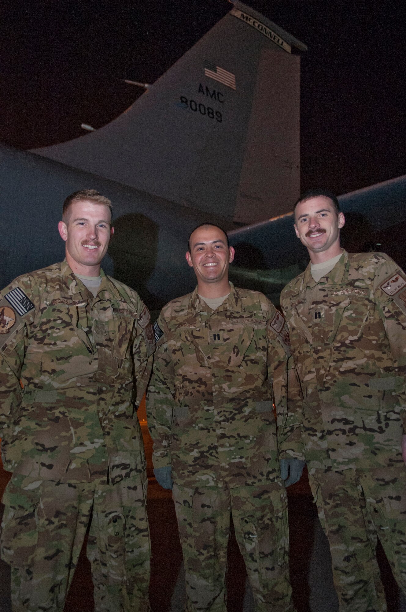 Senior Airman Alex Woosley, left, Capt. Roque Zarate, center, and Capt. Lucas Miller, right, 22nd Expeditionary Air Refueling Squadron, are KC-135 Stratotanker boom operator and pilots, respectfully, deployed to  Transit Center at Manas, Kyrgyzstan. They are the last crew to deploy from McConnell Air Force Base, Kans. Woosley is native of Ramona, Calif. Zarate is native of Rio Rancho, N.M. and Miller is a native of Rossford, Ohio. (U.S. Air Force photo/Staff Sgt. Robert Barnett)