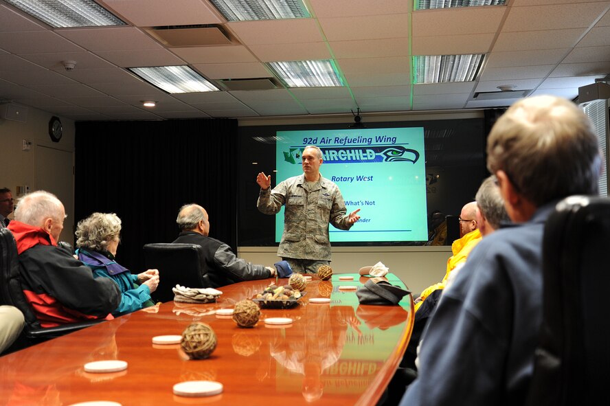 Col. Brian Newberry, 92nd Air Refueling Wing commander, speaks with Rotary Spokane West members during a base tour at Fairchild Air Force Base, Wash., Nov. 5, 2013. Members received a tour that held stops at Hangar Two for a KC-135 Stratotanker static display, Aerospace Physiology, Military Working Dog Facility and the Headquarters building. (U.S. Air Force photo by Airman 1st Class Janelle Patiño/Released)