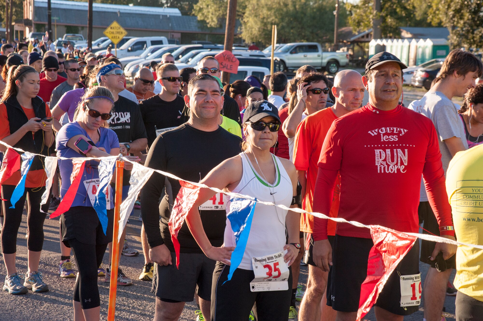 Runners line-up to prepare for the start of the 3rd Annual Running with the Bulls event at the Brown Plaza in Del Rio, Texas, Nov. 2, 2013. The event is held annually to help gather support for Val Verde Loaves and Fishes. (U.S. Air Force photo/Senior Airman Maysonet)