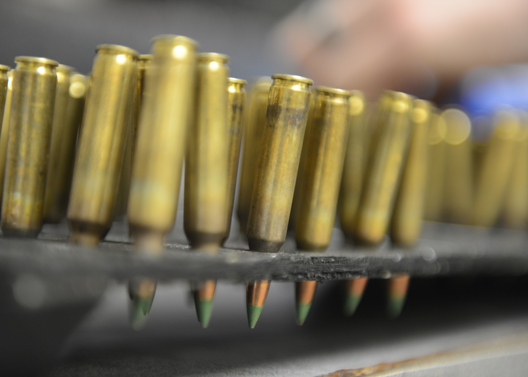 In order to save money and time, armory rounds are placed on a blocking device built from an ammunition crate lid, Shaw Air Force Base, S.C., Oct. 15, 2013. The ammunition was counted and checked to ensure serviceability. (U.S. Air Force photo by Tech. Sgt. Frank Miller/Released)