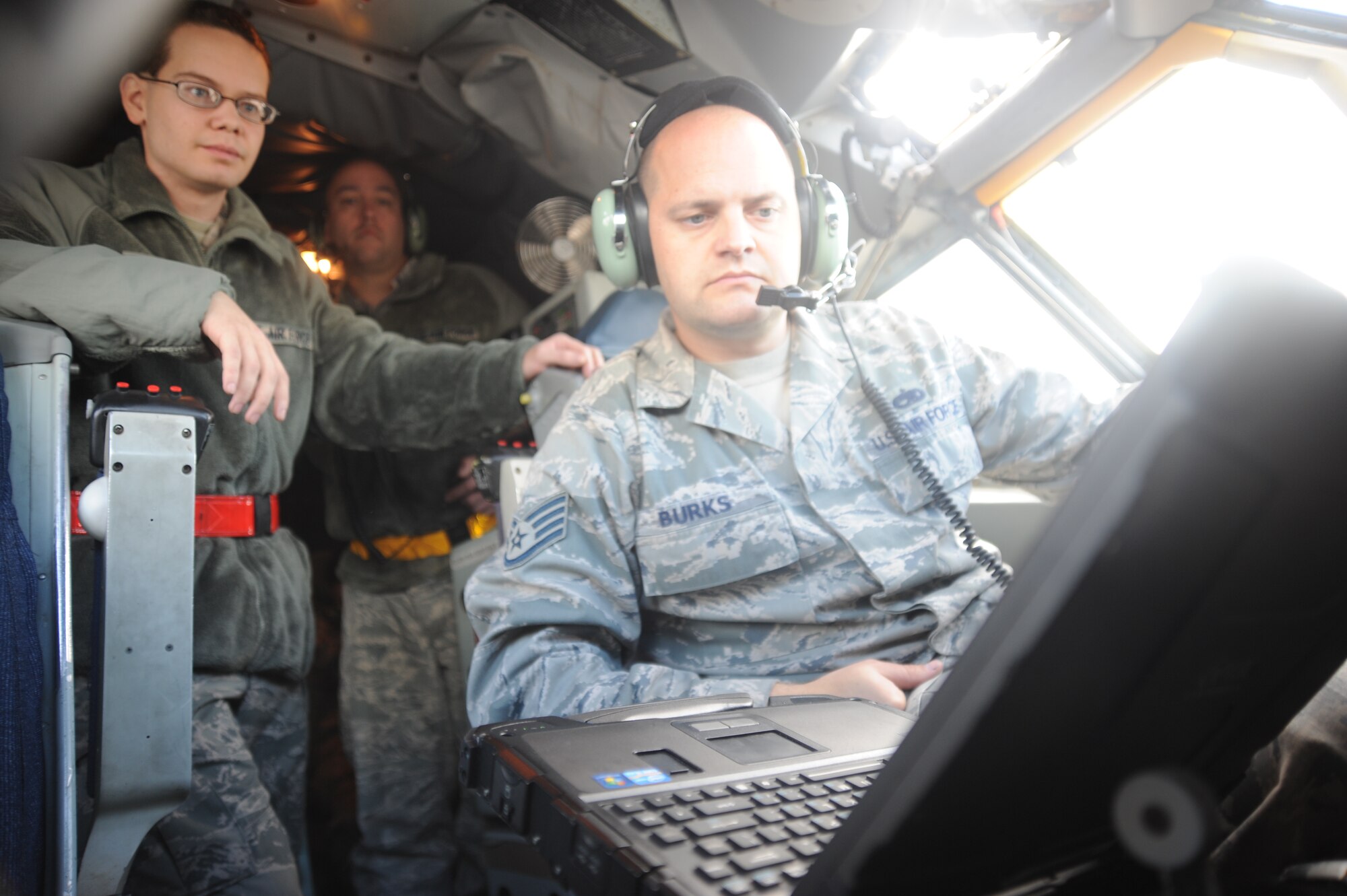 Airman 1st Class Joseph Roberds, 22nd Maintenance Squadron aircraft electrical environmental apprentice, and Staff Sgt. Kyle Burks, 22nd MXS electrical environmental craftsman, follow technical orders+ to pressurize the KC-135 Stratotanker Nov. 1, 2013, at McConnell Air Force Base, Kan. The Airmen provide routine checks on cabin pressurization, which is a necessity for aircrew flying at high altitude. (U.S. Air Force photo/Senior Airman Maurice A. Hodges)