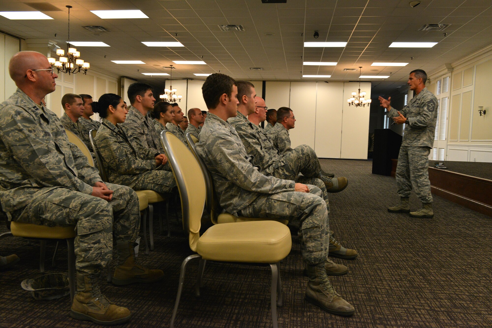 Chief Master Sgt. Richard Parsons, Air Combat Command command chief, speaks to company grade officers during a mentor session, Shaw Air Force Base, S.C., Oct. 30, 2013.  Parsons spoke about changes in the Air Force and maintaining a balance between “efficiency and effectiveness.” (U.S. Air Force photo by Airman 1st Class Jensen Stidham)