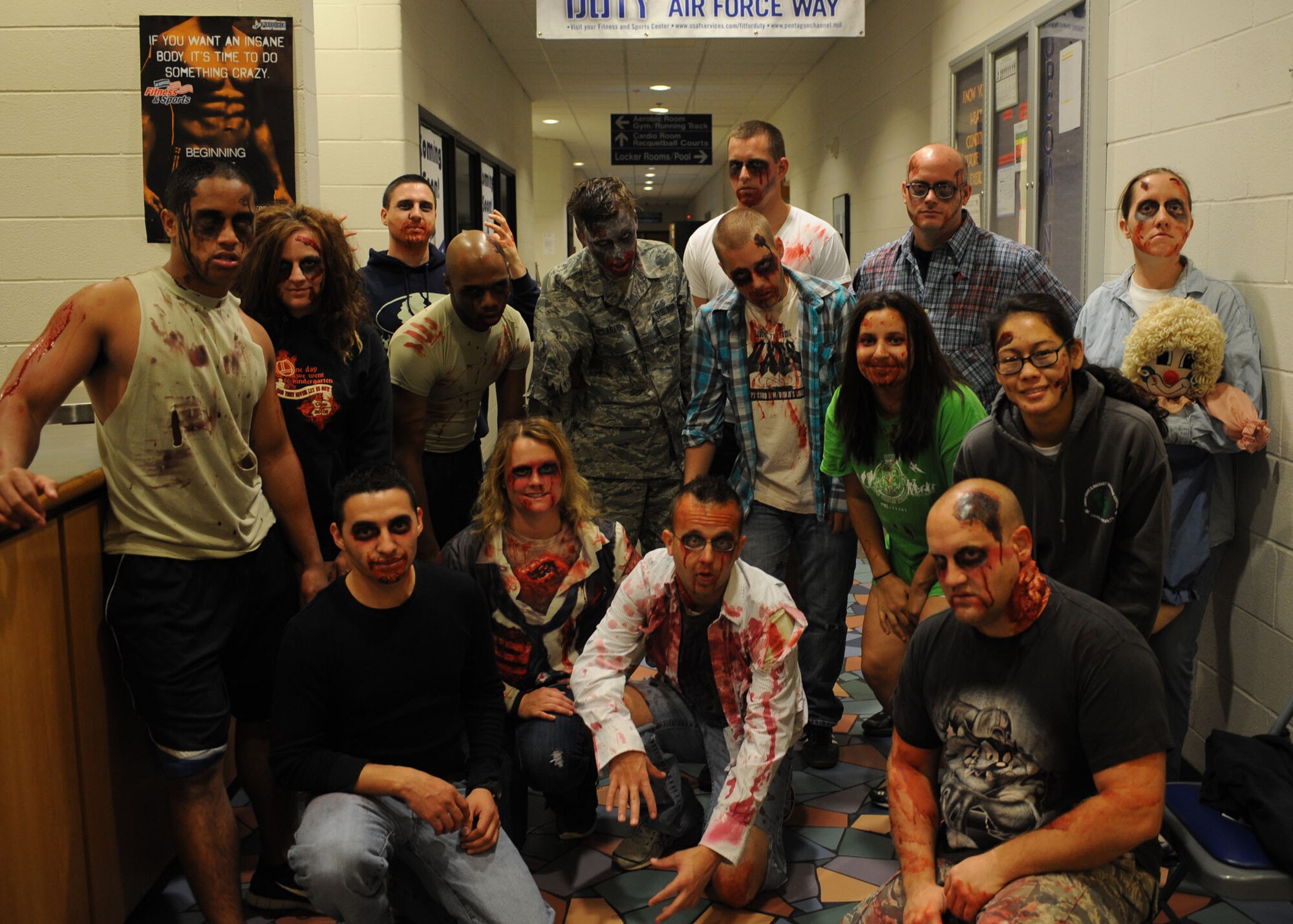 Dyess Airmen, dressed as zombies, prepare for the Post-Apocalyptic Relay Oct. 31, 2013, at Dyess Air Force Base, Texas. The Dyess Fitness Center hosted the event to help boost morale by encouraging Airmen to work together and to strategize to survive. Airmen had to make it through an entire four mile course without getting infected by zombies. They used water guns and water balloons as their defense, so they could collect essential items and make it back safely. (U.S. Air Force photo by Senior Airman Shannon Hall/Released)