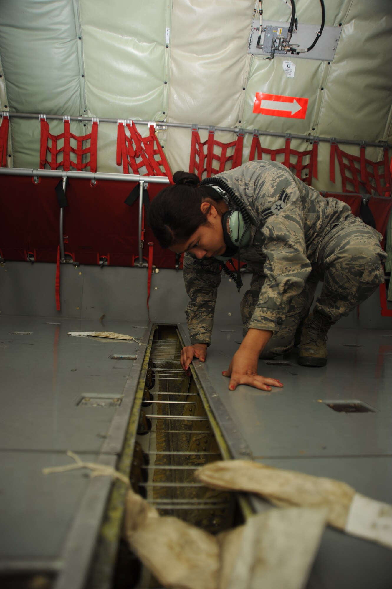 Airman 1st Class Alyxandria Castillo, 22nd Maintenance Squadron section apprentice, checks a seal inside a KC-135 Stratotanker Nov. 1, 2013, at McConnell Air Force Base, Kan. The seal makes sure air stays in the aircraft during cabin pressurization. Cabin pressurization becomes necessary at high altitudes to protect aircrew from a number of problems such as hypoxia and altitude sickness. (U.S. Air Force photo/Senior Airman Maurice A. Hodges)