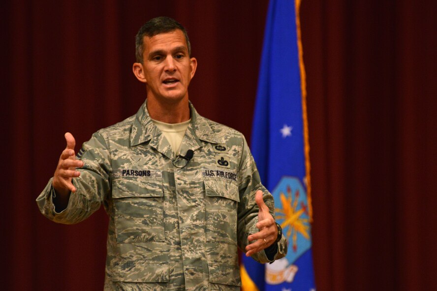 Chief Master Sgt. Richard Parsons, Air Combat Command command chief, speaks to Airmen during an all-call, Shaw Air Force Base, S.C., Oct. 30, 2013.  Parsons spoke about new changes in the Air Force as well as answered questions from the Airmen. (U.S. Air Force photo by Airman 1st Class Jensen Stidham)