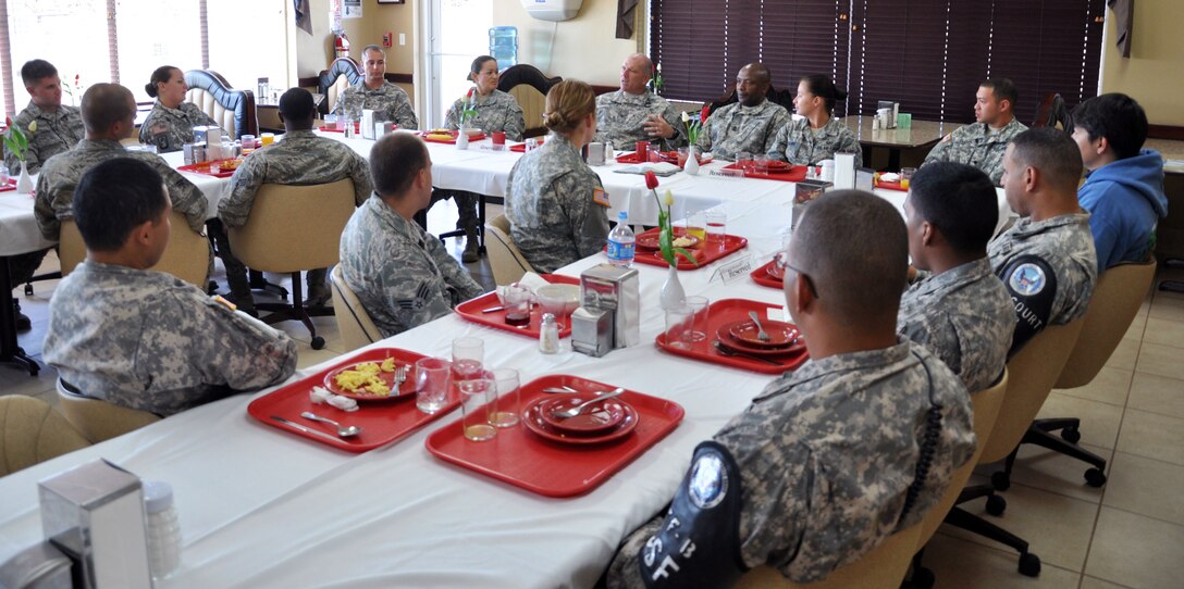 U.S. Army Col. Thomas Boccardi, Joint Task Force-Bravo commander, and Command Sgt. Maj. Valmond Martin, have breakfast with junior enlisted members of Joint Task Force-Bravo at the base dining facility at Soto Cano Air Base, Honduras, Nov. 5, 2013.  The breakfast was a special time for the members to have one on one interaction with Joint Task Force-Bravo leadership.  Boccardi and Martin listened to the junior enlisted members and discussed with them current issues that are affecting the junior enlisted personnel at Joint Task Force-Bravo.  (U.S. Air Force photo by Capt. Zach Anderson)