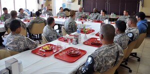 U.S. Army Col. Thomas Boccardi, Joint Task Force-Bravo commander, and Command Sgt. Maj. Valmond Martin, have breakfast with junior enlisted members of Joint Task Force-Bravo at the base dining facility at Soto Cano Air Base, Honduras, Nov. 5, 2013.  The breakfast was a special time for the members to have one on one interaction with Joint Task Force-Bravo leadership.  Boccardi and Martin listened to the junior enlisted members and discussed with them current issues that are affecting the junior enlisted personnel at Joint Task Force-Bravo.  (U.S. Air Force photo by Capt. Zach Anderson)