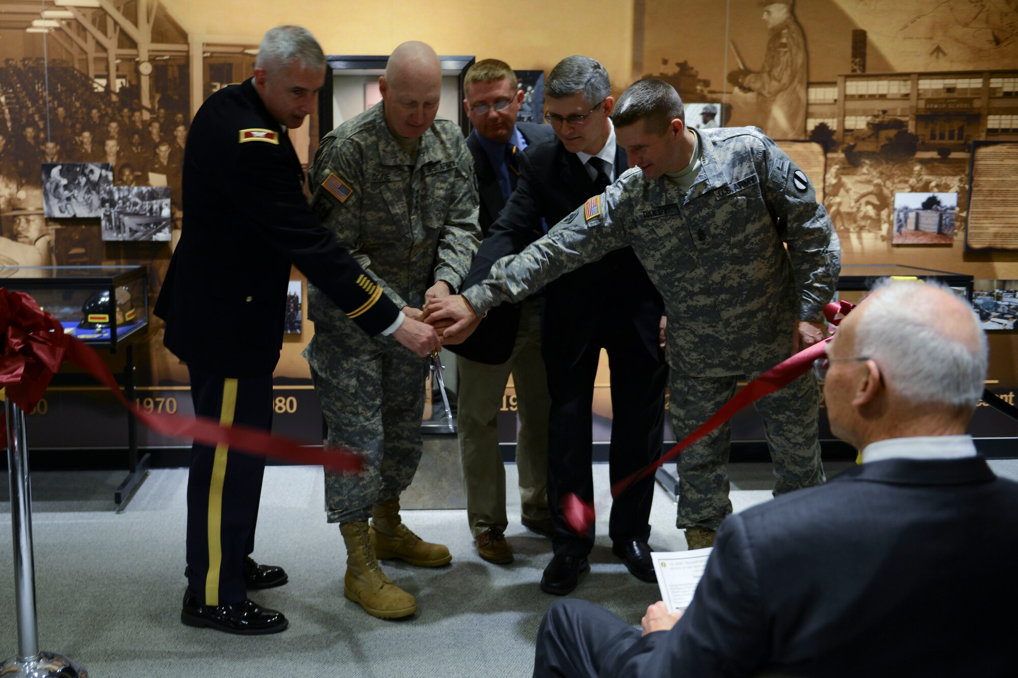 U.S. Army leaders ceremonially cut the ribbon to open a new U.S. Army Training and Doctrine Command exhibit at the Army Transportation Museum at Fort Eustis, Va., Nov. 4, 2013. The exhibit details the history of TRADOC, which celebrates its 40th anniversary as an Army major command. (U.S. Air Force photo by Staff Sgt. Ciara Wymbs/Released) 