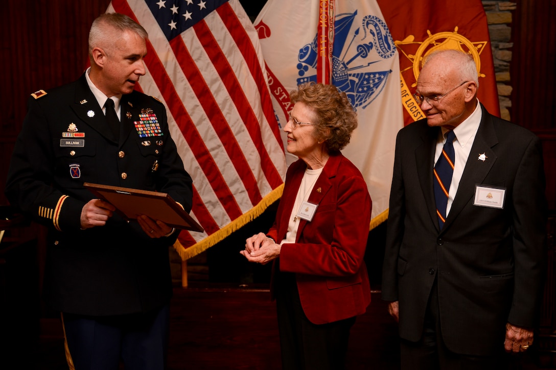 U.S. Army Col. John P. Sullivan, Transportation Corps chief of transportation, presents Helen Tuttle, wife of retired U.S. Army Gen. William Tuttle, former Army Materiel Command commanding general, with the Patronus Rotae, or “Patron of the Wheel,” award, at the Army Transportation Museum at Fort Eustis, Va., Nov. 4, 2013. The Patronus Rotae was approved by the 20th Chief of Transportation, U.S. Army Lt. Gen. Robert T. Dail, as an award to recognize the spouses of Transportation Corps Soldiers for significant contributions to the corps and their communities. (U.S. Air Force photo by Staff Sgt. Ciara Wymbs/Released)