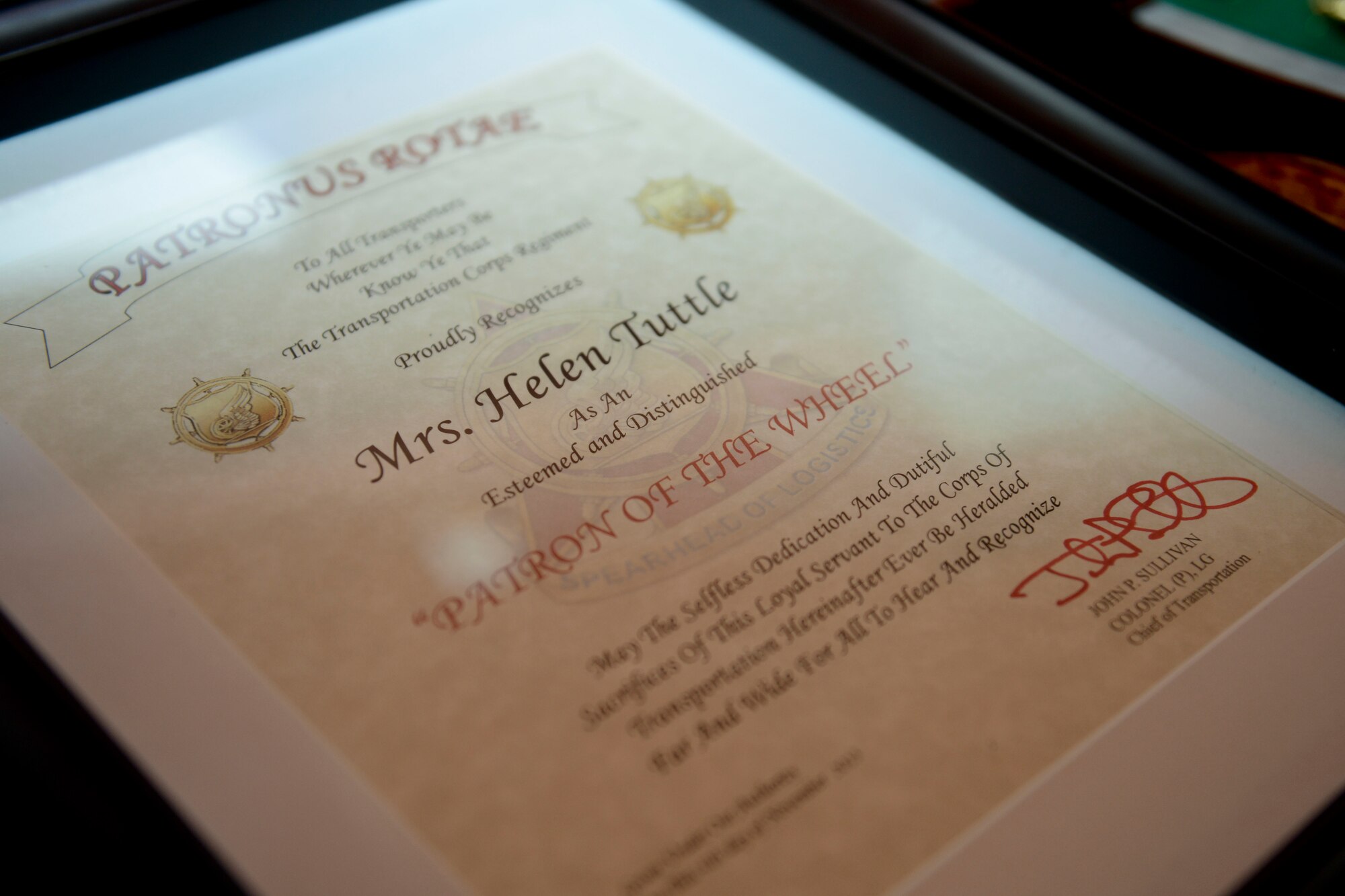 Helen Tuttle, wife of retired U.S. Army Gen. William Tuttle, former commanding general of Army Materiel Command, received the Patronus Rotae award in a ceremony at the Army Transportation Museum at Fort Eustis, Va., Nov. 4, 2013. The award, whose name means “Patron of the Wheel,” is presented to spouses of Transportation Corps Soldiers for their positive impact on their community, unit and across the Transportation Corps. (U.S. Air Force photo by Staff Sgt. Ciara Wymbs/Released)