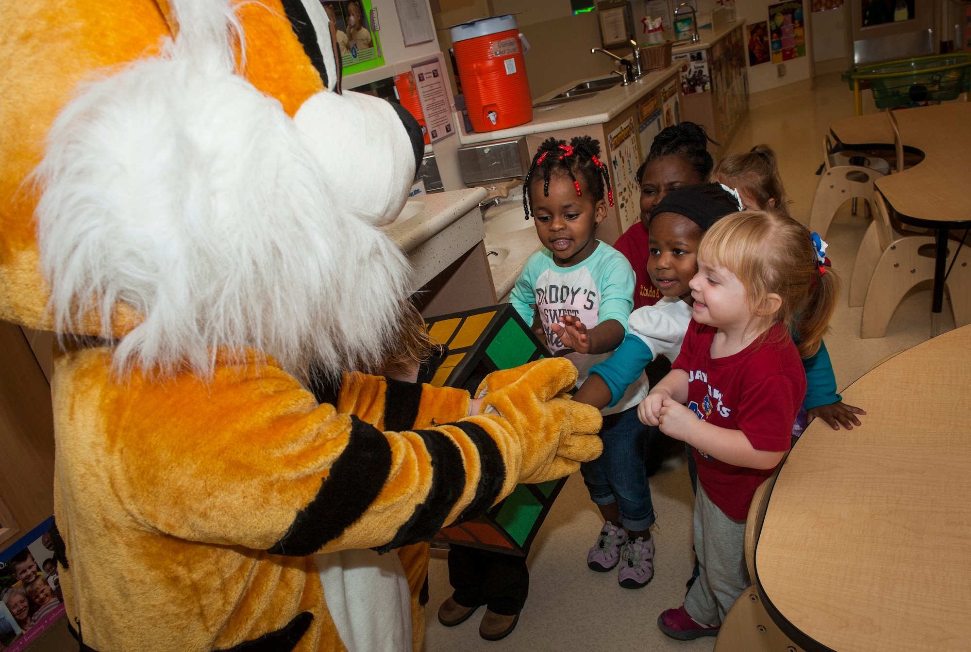 The 23d Wing mascot visits children at the Child Development Center II for Energy Action Month at Moody Air Force Base, Ga., Nov. 1, 2013. Energy Action Month is observed every October with the goal of promoting energy and water conservation awareness. (U.S. Air Force photo by Senior Airman Jarrod Grammel/Released)
