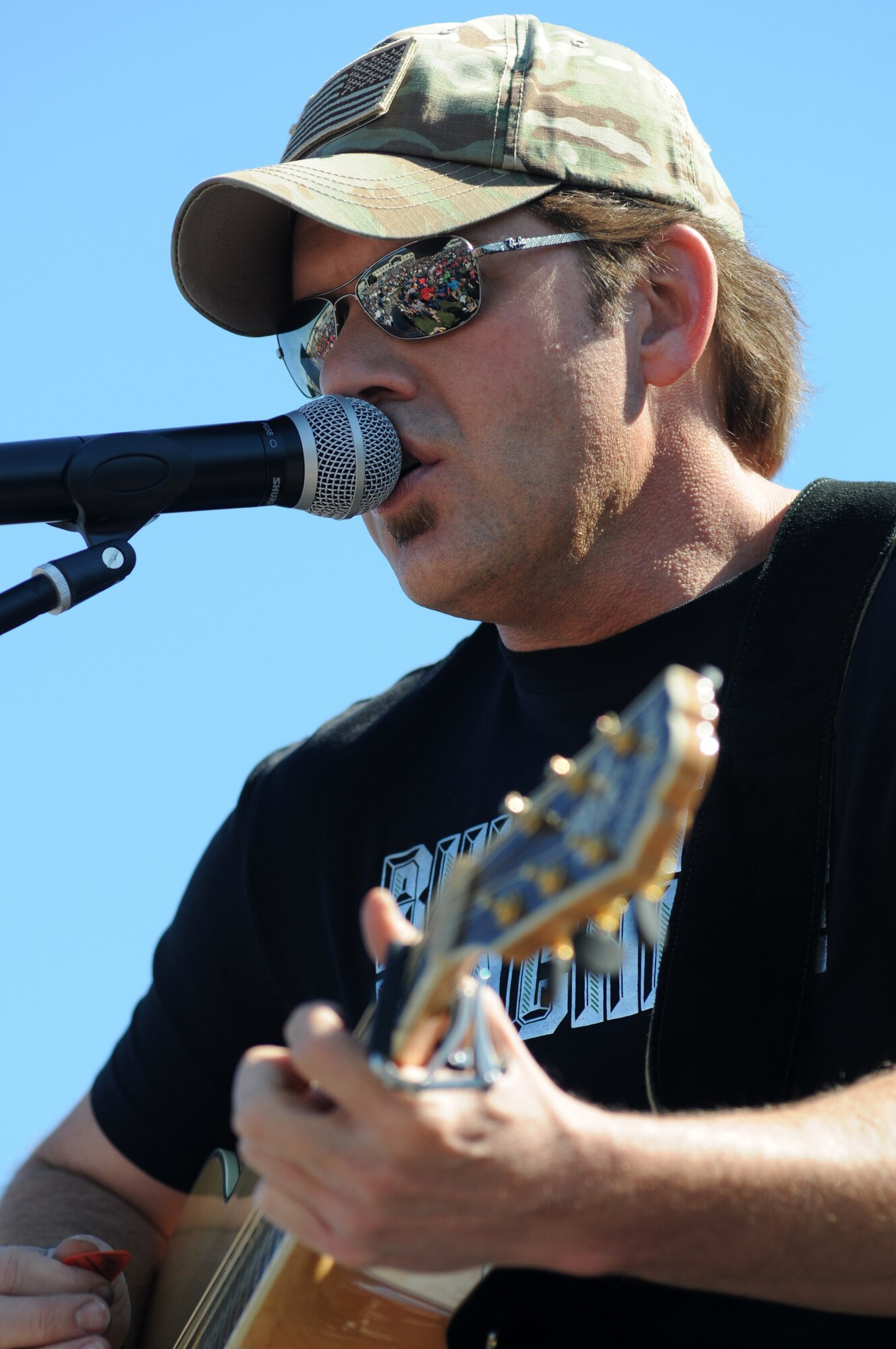 Rodney Atkins, country singer, performs during a concert Nov. 2, 2013, at the Triangle Parade Field, Keesler Air Force Base, Miss.  Local band, Autumn Rise-N, also performed.  (U.S. Air Force photo by Kemberly Groue)