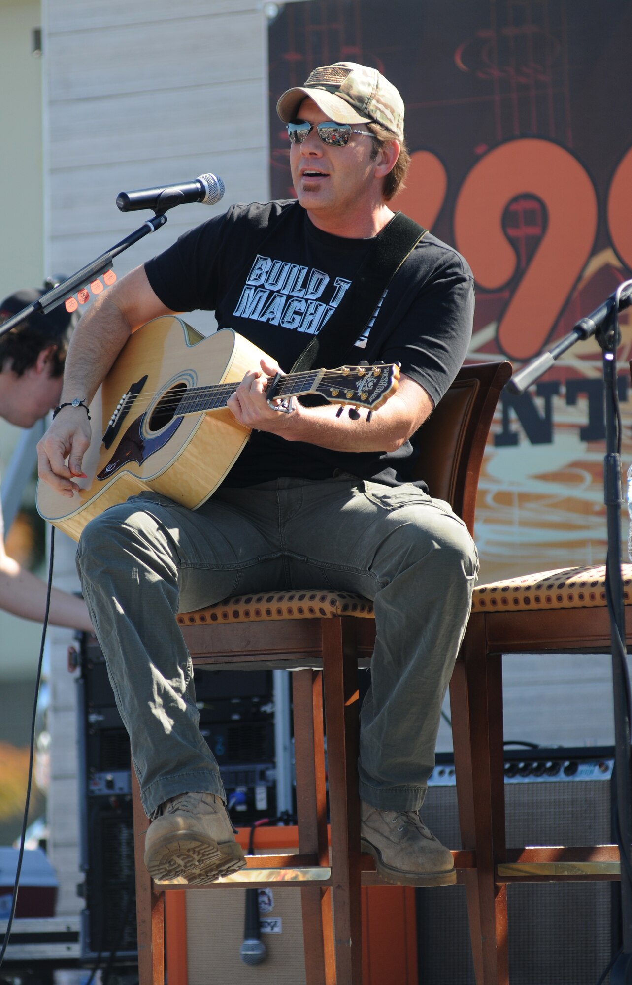 Rodney Atkins, country singer, performs during a concert Nov. 2, 2013, at the Triangle Parade Field, Keesler Air Force Base, Miss.  Local band, Autumn Rise-N, also performed.  (U.S. Air Force photo by Kemberly Groue)