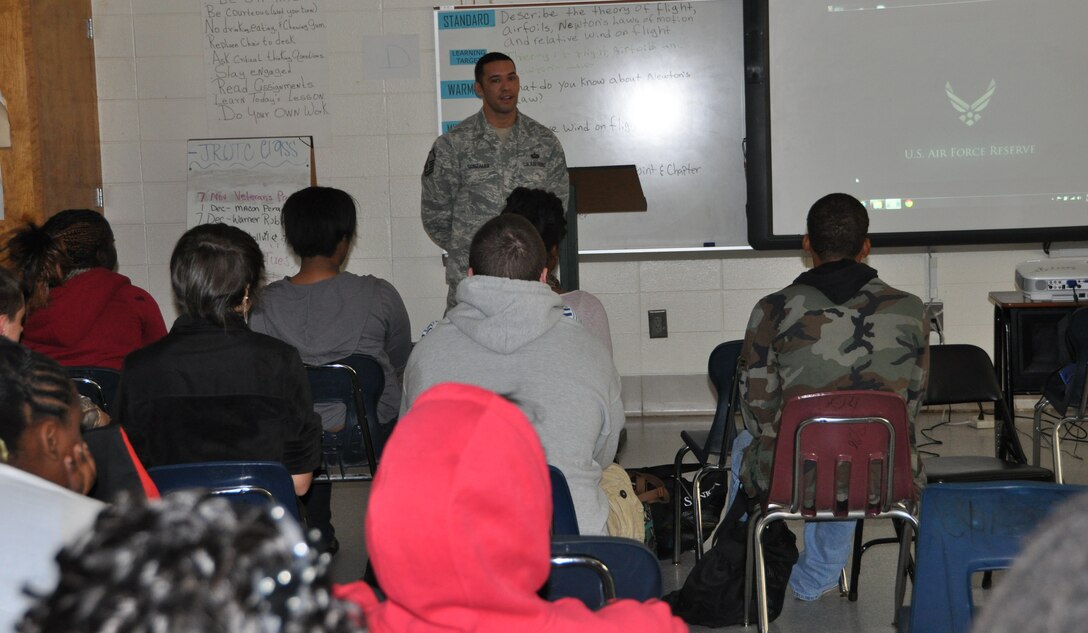ROBINS AIR FORCE BASE, Ga. - Master Sgt. Michael Gonzales, NCOIC of plans and programs at the Readiness Management Group here, talks about his military experience to Twiggs County High School students during its Veteran's Day program Nov. 5 in Jeffersonville, Ga. 