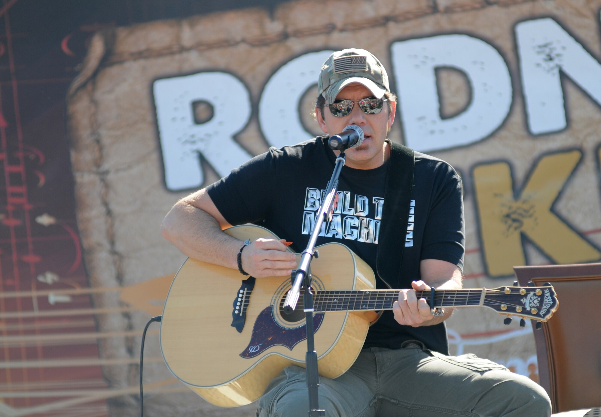 Rodney Atkins, country singer, performs during a concert Nov. 2, 2013, at the Triangle Parade Field, Keesler Air Force Base, Miss.  Local band, Autumn Rise-N, also performed.  (U.S. Air Force photo by Kemberly Groue)
