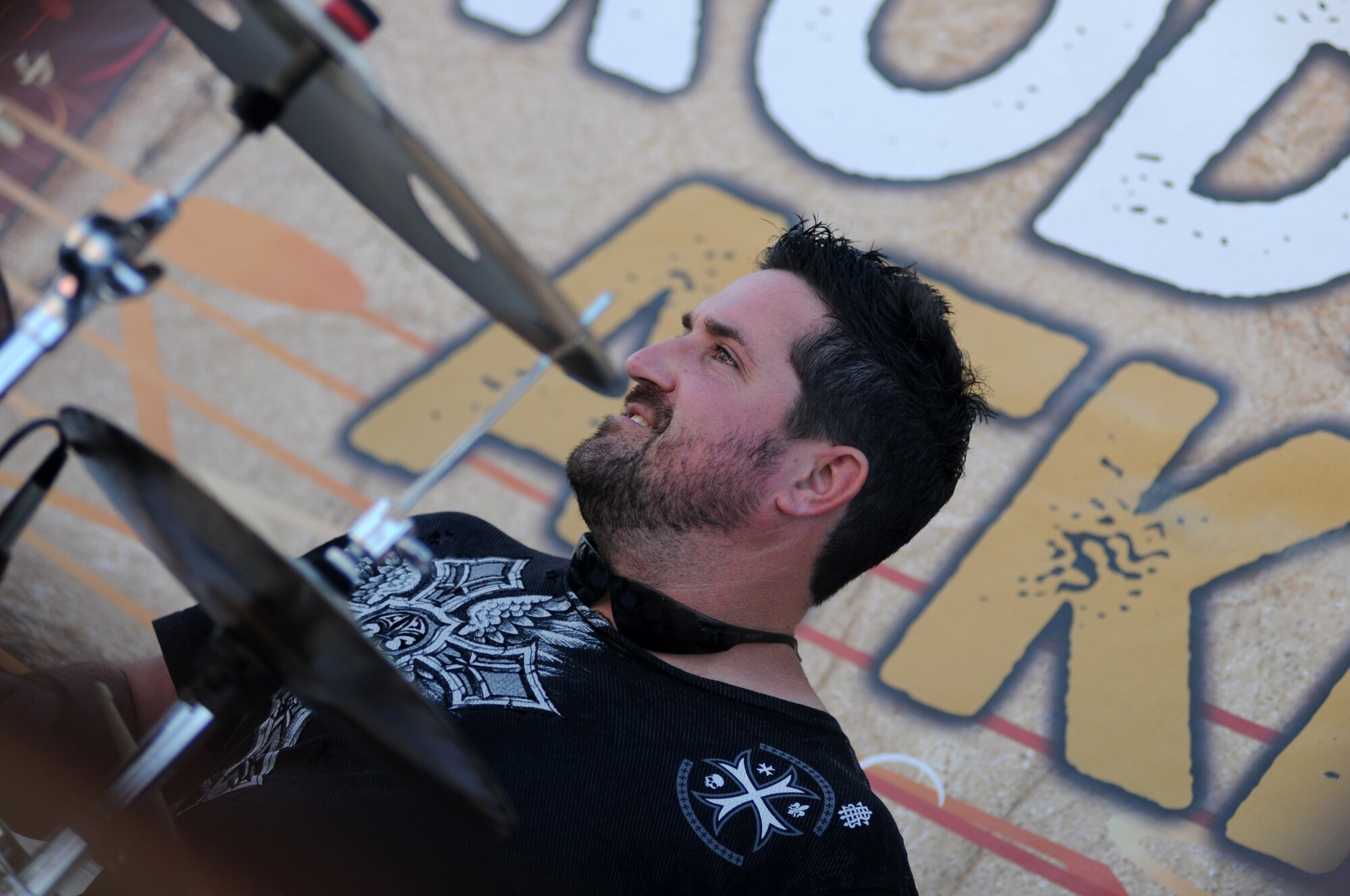 Jamie Shaw, drummer for local band Autumn Rise-N performs prior to the Rodney Atkins concert Nov. 2, 2013, at the Triangle Parade Field, Keesler Air Force Base, Miss.  Airmen and Keesler personnel attended the event.  (U.S. Air Force photo by Kemberly Groue)