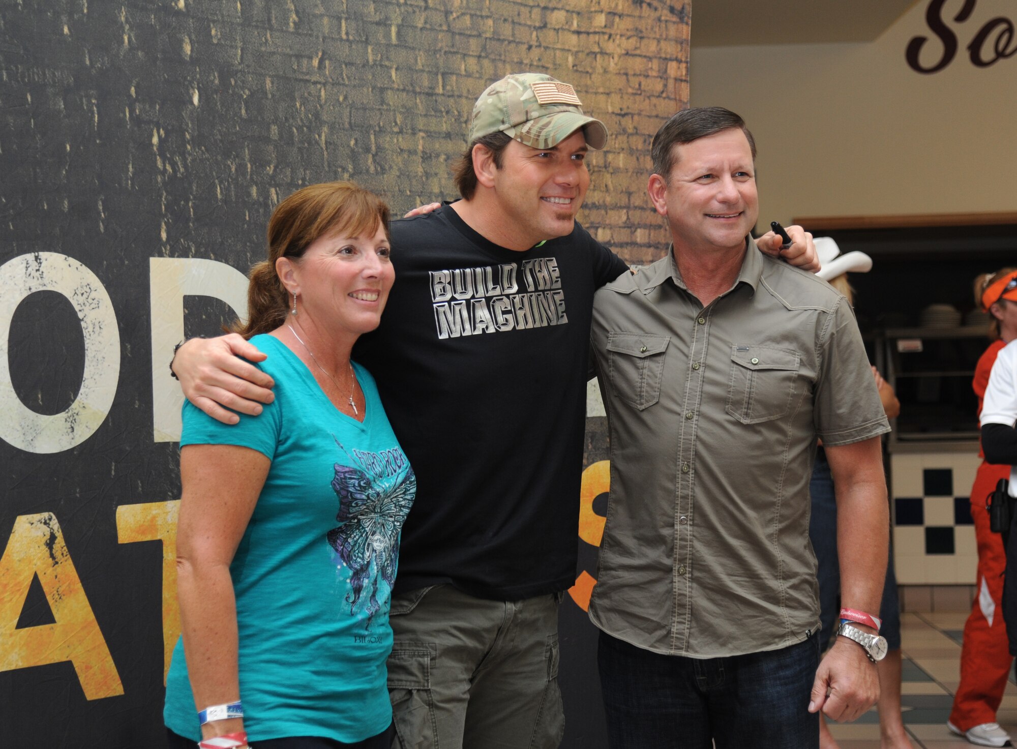 Maj. Gen. Leonard Patrick , 2nd Air Force commander, and his wife meet country music singer Rodney Atkins following a concert performed by Atkins Nov. 2, 2013, at the Magnolia Dining Facility, Keesler Air Force Base, Miss.  Local band Autumn Rise-N also performed.  (U.S. Air Force photo by Kemberly Groue)