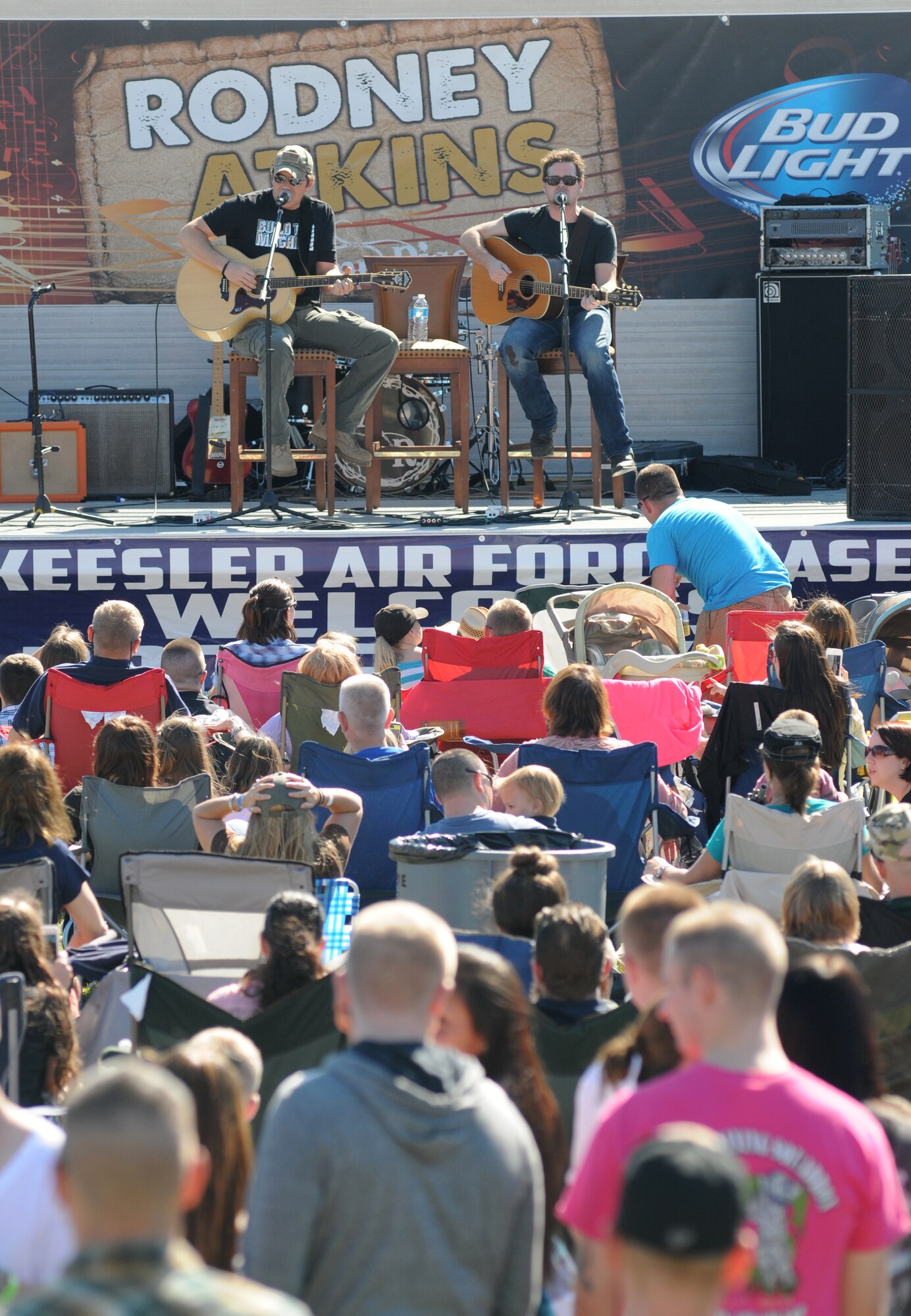 Country singer Rodney Atkins performs with Liam Bailey during a concert Nov. 2, 2013, at the Triangle Parade Field, Keesler Air Force Base, Miss.  Local band, Autumn Rise-N, also performed.  (U.S. Air Force photo by Kemberly Groue)