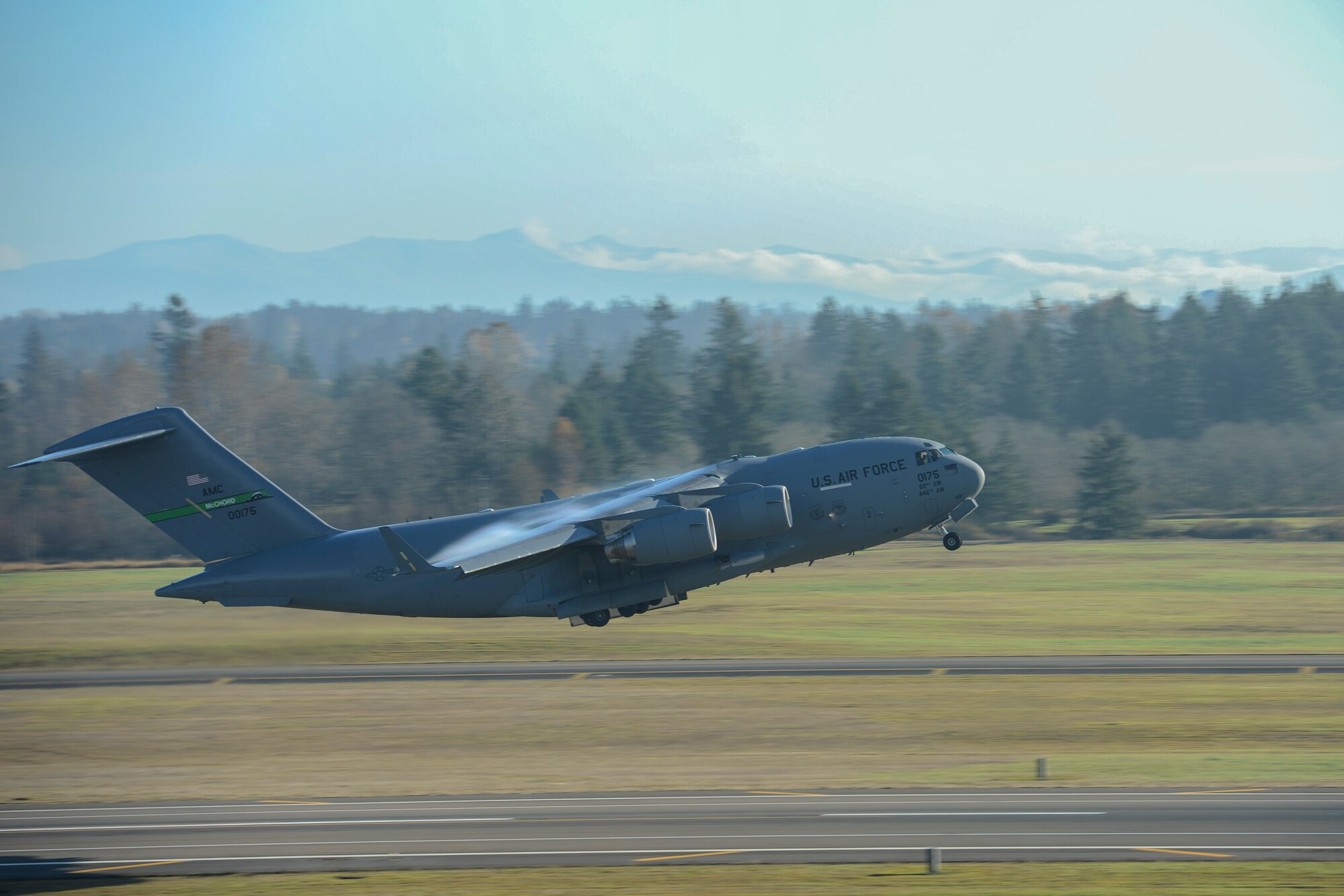 Airmen from the 62nd Operations Group takeoff from McChord Field, during a training mission, Nov. 4, 2013 at Joint Base Lewis-McChord, Wash. The training mission incorporated numerous multi-element training scenarios including airdrops, low level flight maneuvers and mid-air refueling. (U.S. Air Force Photo/Airman 1st Class Jacob Jimenez) 