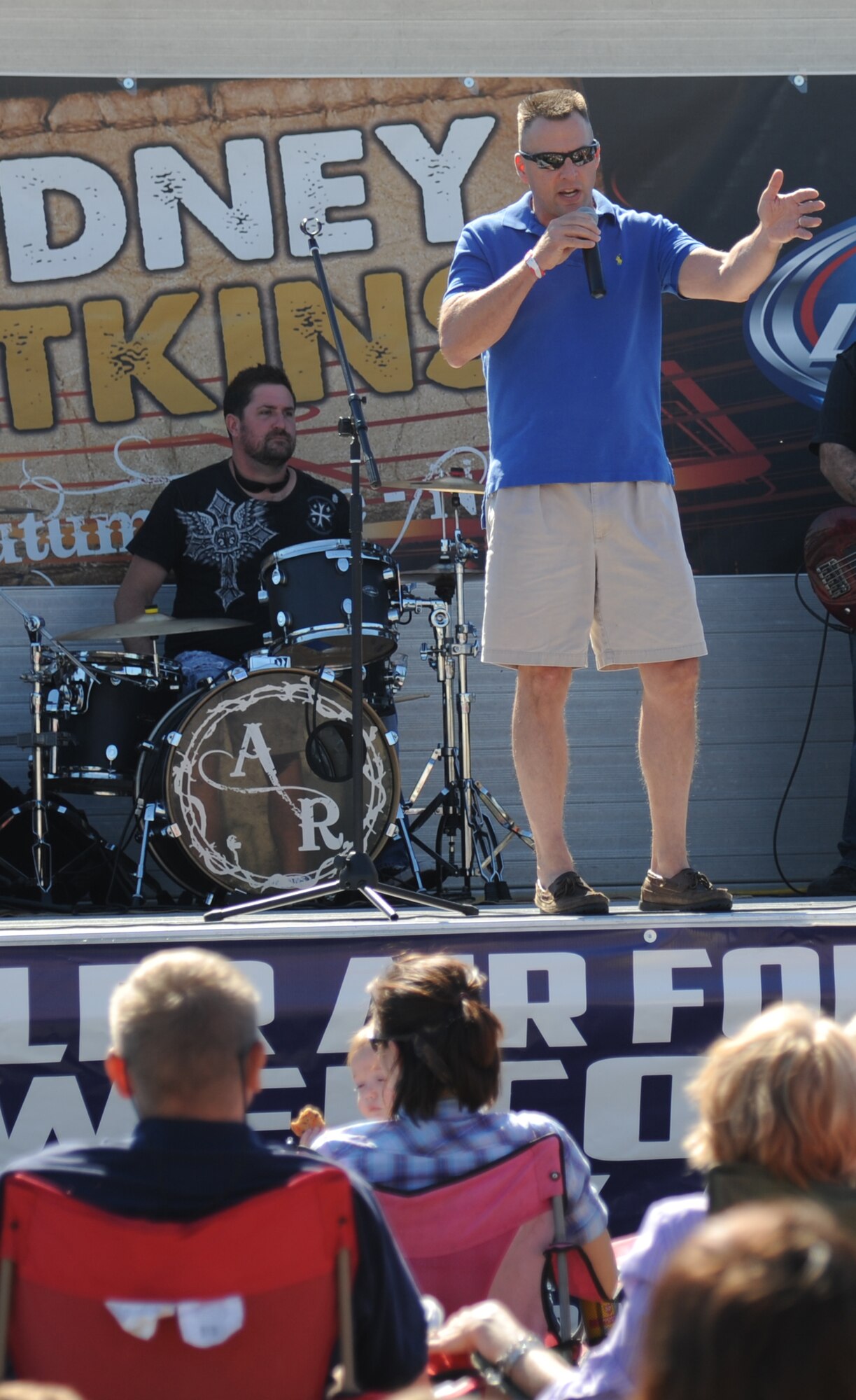 Brig. Gen. Patrick Higby, 81st Training Wing commander, delivers opening remarks for the Rodney Atkins concert Nov. 2, 2013, at the Triangle Parade Field, Keesler Air Force Base, Miss.  Local band Autumn Rise-N also performed.  (U.S. Air Force photo by Kemberly Groue)