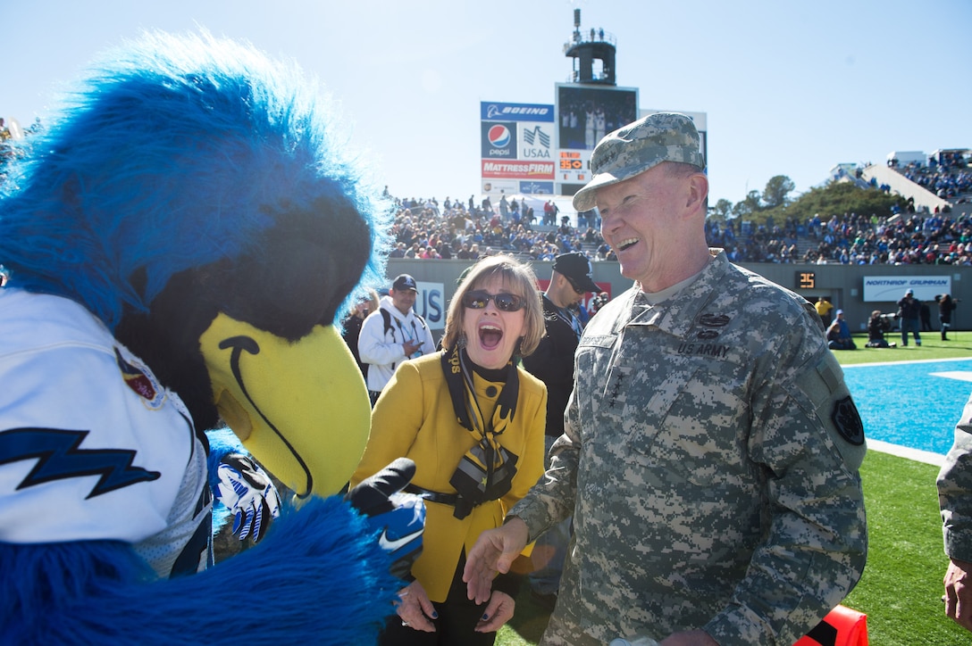 U.S. Army Gen. Martin E. Dempsey, right, chairman of the Joint Chiefs of Staff, and his wife, Deanie, meet the U.S. Air Force Academy mascot during an Air Force-Army football game at the U.S. Air Force Academy’s Falcon Stadium in Colorado Springs, Colo., Nov. 2, 2013. The Air Force Falcons beat the Army Black Knights 42-28.  (DOD photo by U.S. Navy Petty Officer 1st Class Daniel Hinton/Released)