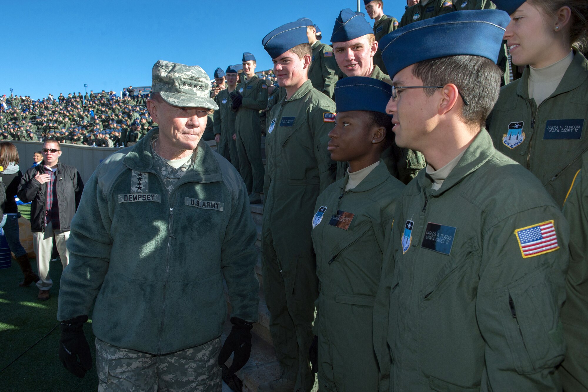 U.S. Army Gen. Martin E. Dempsey, chairman of the Joint Chiefs of Staff, greets U.S. Air Force Academy cadets before the start of an Air Force-Army football game at the U.S. Air Force Academy’s Falcon Stadium in Colorado Springs, Colo., Nov. 2, 2013. Dempsey also attended the Air Force’s annual conference for Coordinating Research on the North Atlantic, also known as Corona, during his two-day visit to Colorado. (DOD photo by U.S. Navy Petty Officer 1st Class Daniel Hinton/Released)
