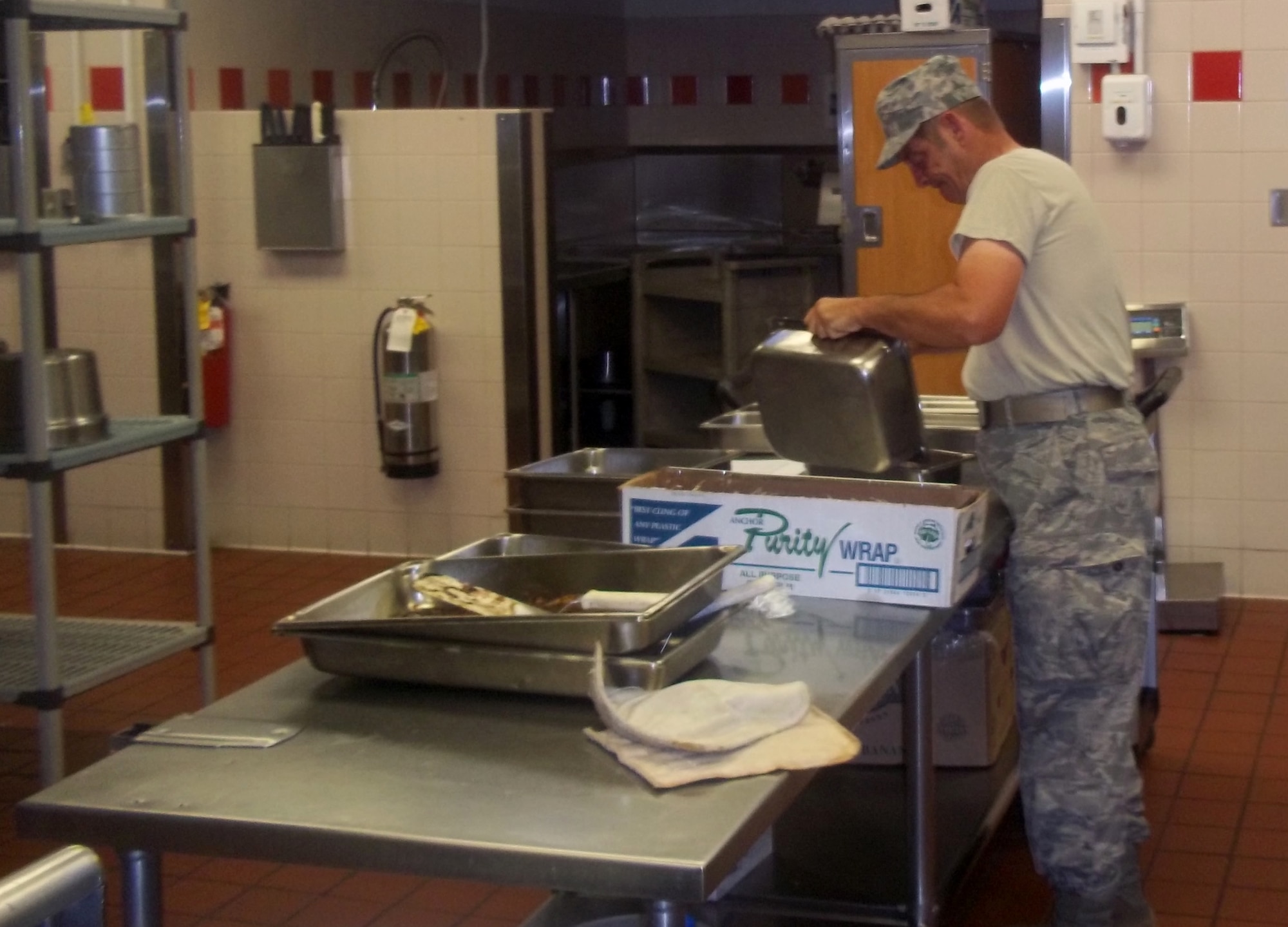 Senior Airman Arvil Williams, a services specialist with the 188th Force Support Squadron’s Sustainment Services Element, works in the kitchen at Joint Base Pearl Harbor-Hickam, Hawaii, Sept. 16, 2013. 188th Airmen gained valuable on-the-job training working alongside their active-duty counterparts throughout the base during their two-week exercise. (U.S. Air National Guard photo by Senior Master Sgt. Brian Vinsant)