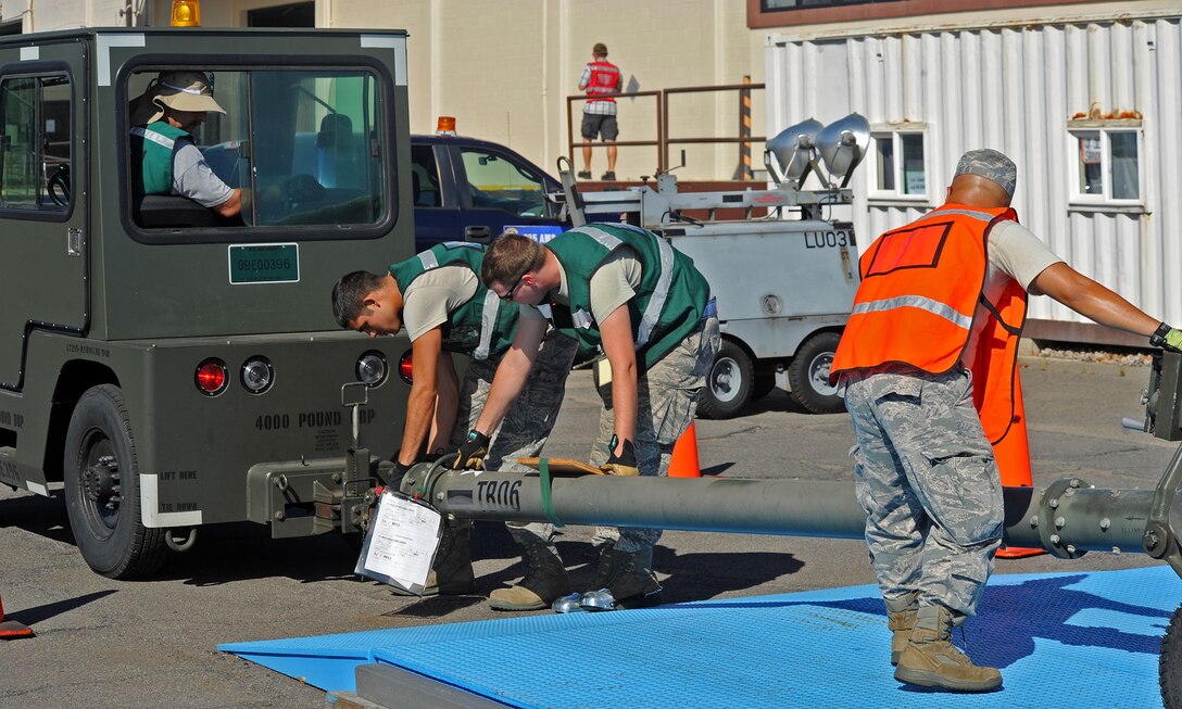 Joint Base Pearl Harbor-Hickam personnel prepare equipment for transport near the flightline during an Operational Readiness Inspection at JBPHH, Hawaii, Nov. 3, 2013. Airmen from both the USAF 15th Wing and Hawaii Air National Guard 154th Wing participated in the exercise which evaluated war time survival skills in a Total Force Integration environment. (U.S. Air Force photo/Tech. Sgt. Jerome Tayborn)