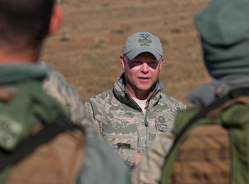 Senior Master Sgt. Donald Gallagher, the 620th Ground Combat Training Squadron superintendent, talks to Airmen of the 91st Security Forces Group Oct. 30, 2013 at the end of Road Warrior, a convoy protection exercise at Camp Guernsey, Wyo. The Minot Air Force Base defenders were taking part in the annual exercise conducted by the 620th Ground Combat Training Squadron which train Airmen of the 20th Air Force missile wings in the defense of nuclear assets should they come under attack while being transported in convoys. (U.S. Air Force photo by R.J. Oriez) 