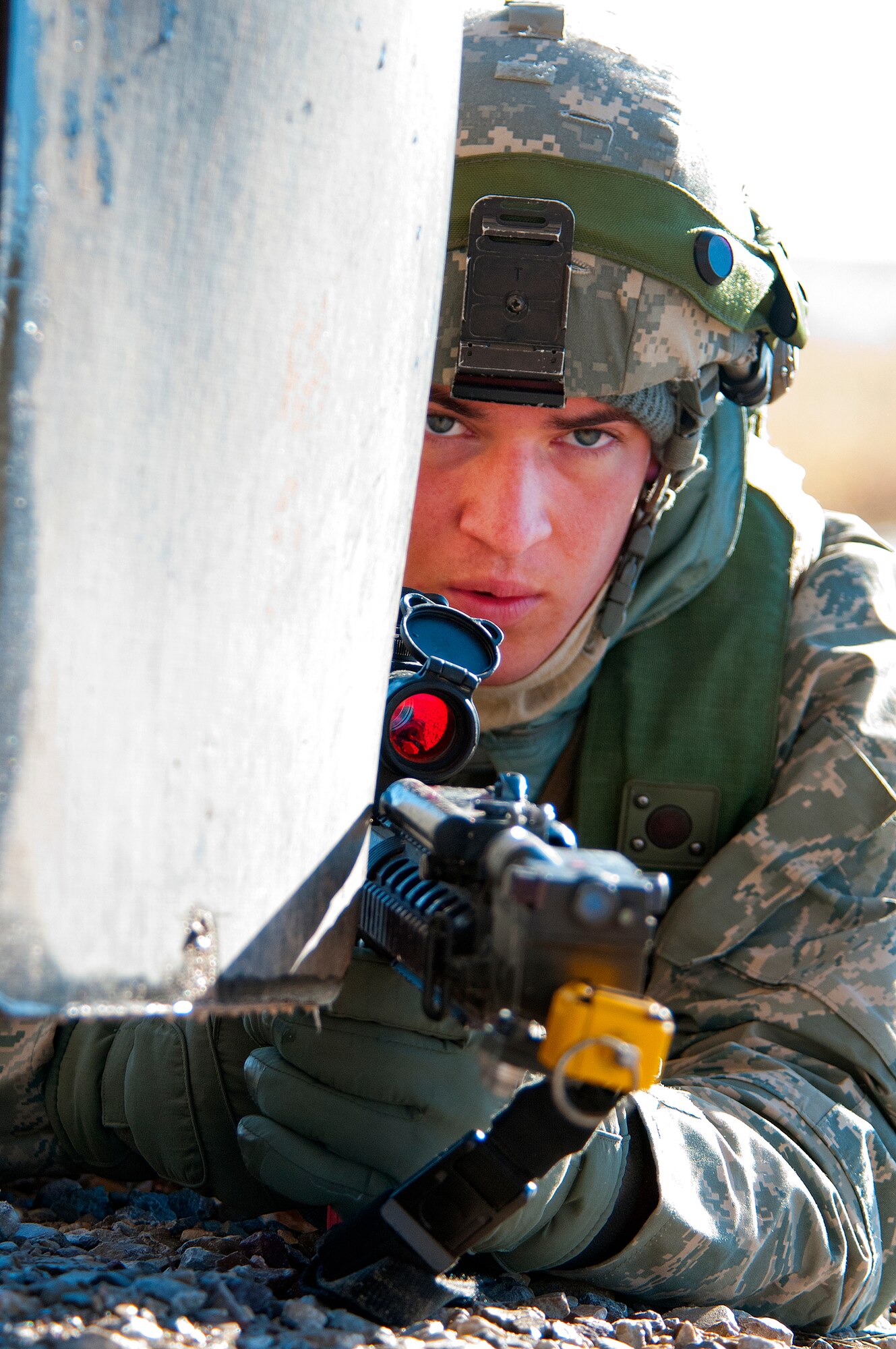 Staff Sgt. Mark Kegel, 791st Missile Security Forces Squadron, keeps a look out for the opposition forces from a defensive position during a convoy protection exercise at Camp Guernsey, Wyo., Oct. 30, 2013. The defenders of the 791st MSFS, and other 91st Security Group squadrons of Minot Air Force Base, were taking part in annual training conducted by the 620th Ground Combat Training Squadron which trains Airmen of the 20th Air Force missile wings in the defense of nuclear assets should they come under attack while being transported in convoys. (U.S. Air Force photo by R.J. Oriez) 