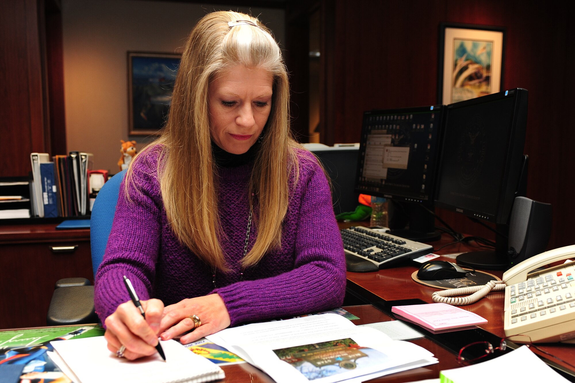 Liz McKenzie, 4th Fighter Wing commander’s secretary, annotates calendar notes at Seymour Johnson Air Force Base, N.C., Nov. 5, 2013. McKenzie said she uses Veteran’s Day as an opportunity to thank Service members, past and present, for protecting our nation’s freedoms. (U.S. Air Force photo by Airman 1st Class John Nieves Camacho)