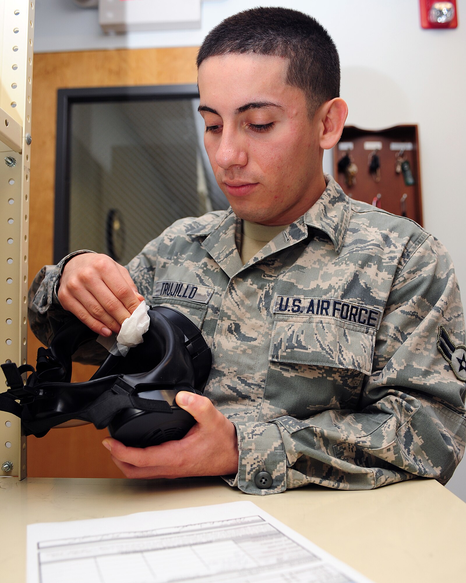 U.S. Air Force Airman 1st Class Elliseo Trujillo, 4th Aerospace Medicine Squadron bioenvironmental engineer, cleans a gas mask at Seymour Johnson Air Force Base, N.C., Nov. 4, 2013. To Trujillo, Veteran’s Day means paying tribute to the Service members who made the ultimate sacrifice while defending America. (U.S. Air Force photo by Airman 1st Class John Nieves Camacho)