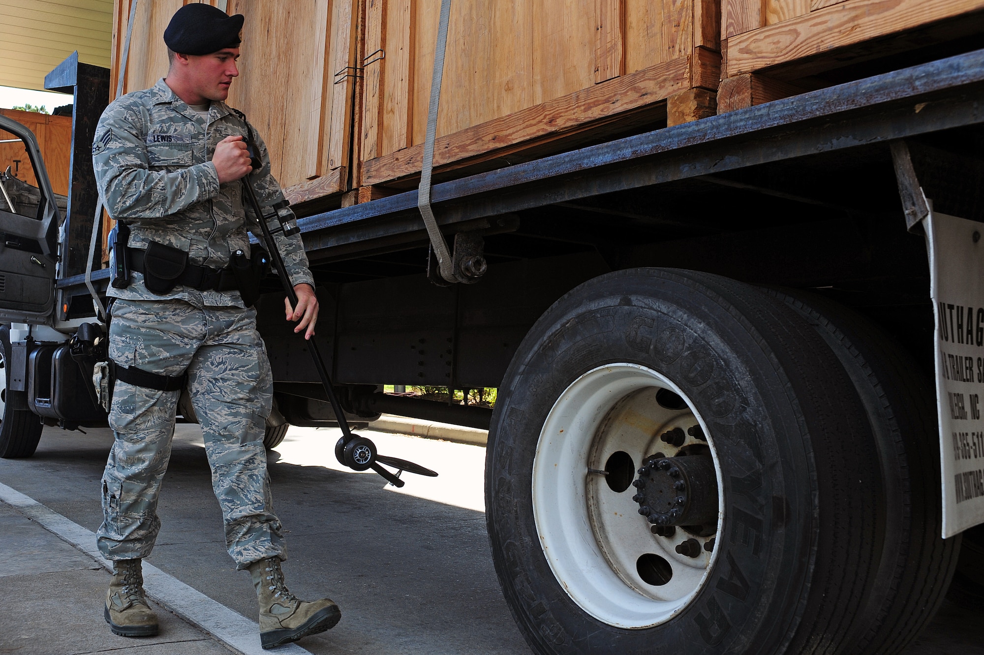 U.S. Air Force Senior Airman Connor Lewis, 4th Security Forces Squadron force protector, searches a truck for contraband at Seymour Johnson Air Force Base, N.C., Nov. 4, 2013. For Lewis, Veteran’s Day means honoring those who served in the military, past and present. (U.S. Air Force photo by Airman 1st Class John Nieves Camacho)