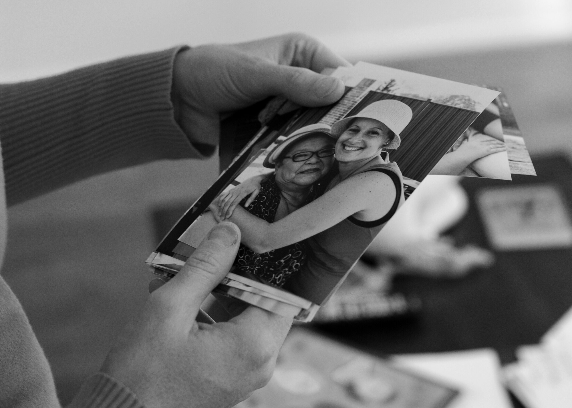 Brandi Jackson displays a photo taken of her and her friend Delfina Borda shortly after being diagnosed with breast cancer during a visit to her home Oct. 29, 2013 at Joint Base Andrews, Md. Jackson leaned on her family and friends after being diagnosed with cancer nearly one year ago. After being treated at Walter Reed National Military Medical Center, Jackson is cancer free. (U.S. Air Force photo/Staff Sgt. Nichelle Anderson)