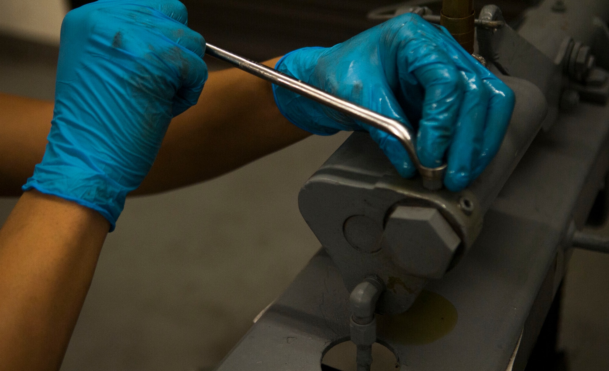 A 23d Equipment Maintenance Squadron equipment maintenance crew chief releases brake fluid from an MHU-141/M munitions trailer at Moody Air Force Base, Ga., Oct. 31, 2013.  Airmen test the brakes as part of the 365-day inspection to ensure a vehicle is serviceable. (U.S. Air Force photo by Airman 1st Class Sandra Marrero/Released)
