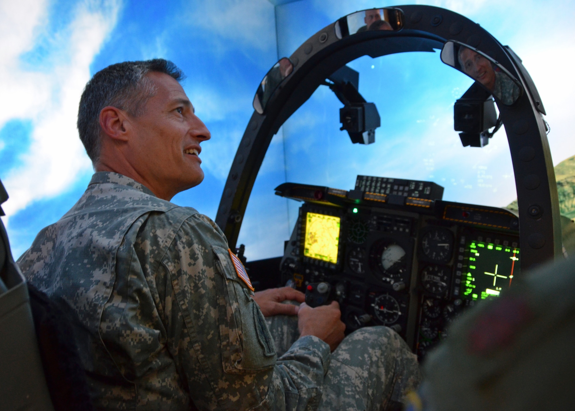 U.S. Army Lt. Gen. Ken Tovo, U.S. Southern Command military deputy commander, flies a mission in the A-10 Thunderbolt II simulator Monday at Davis-Monthan Air Force Base, Ariz.  General Tovo visited Davis-Monthan for an orientation at 12th Air Force (Air Forces Southern) and to thank 12 AF (AFSOUTH) Airmen for their contributions as the air component to U.S. Southern Command. (U.S. Air Force photo/Capt. Justin Brockhoff)