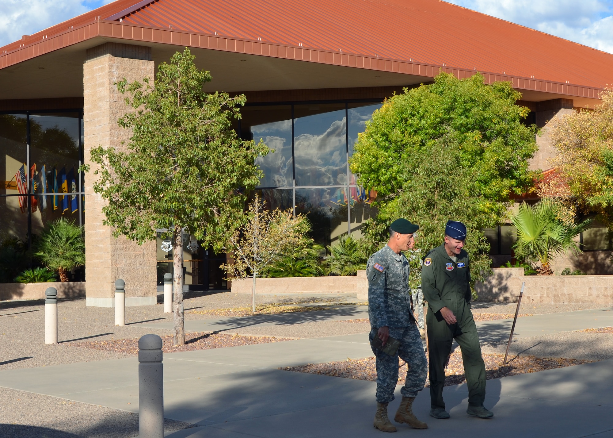U.S. Army Lt. Gen. Ken Tovo, U.S. Southern Command military deputy commander, talks with U.S. Air Force Lt. Gen. Tod Wolters, 12th Air Force (Air Forces Southern) commander, Monday in front of the 12 AF (AFSOUTH) headquarters at Davis-Monthan Air Force Base, Ariz.  General Tovo visited 12 AF (AFSOUTH) for an orientation and to thank Airmen for their contributions as the air component to U.S. Southern Command. (U.S. Air Force photo/Capt. Justin Brockhoff)